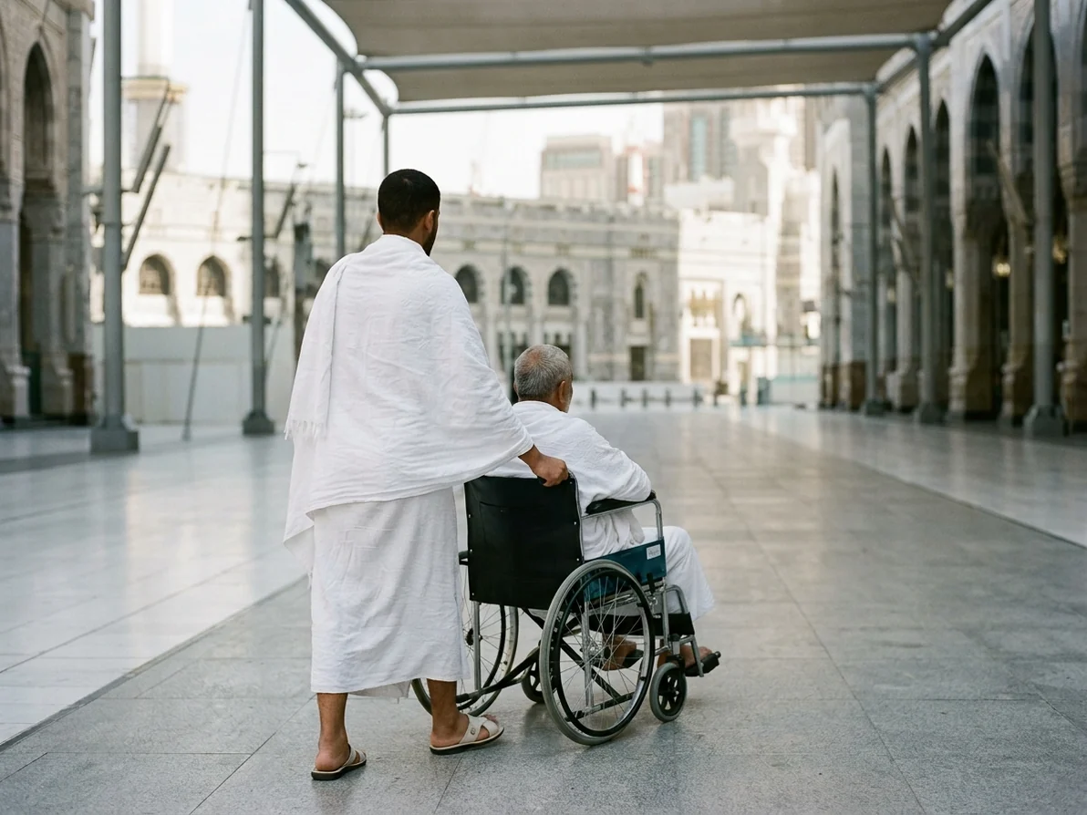 A family member pushing an older pilgrim in a wheelchair along a walkway