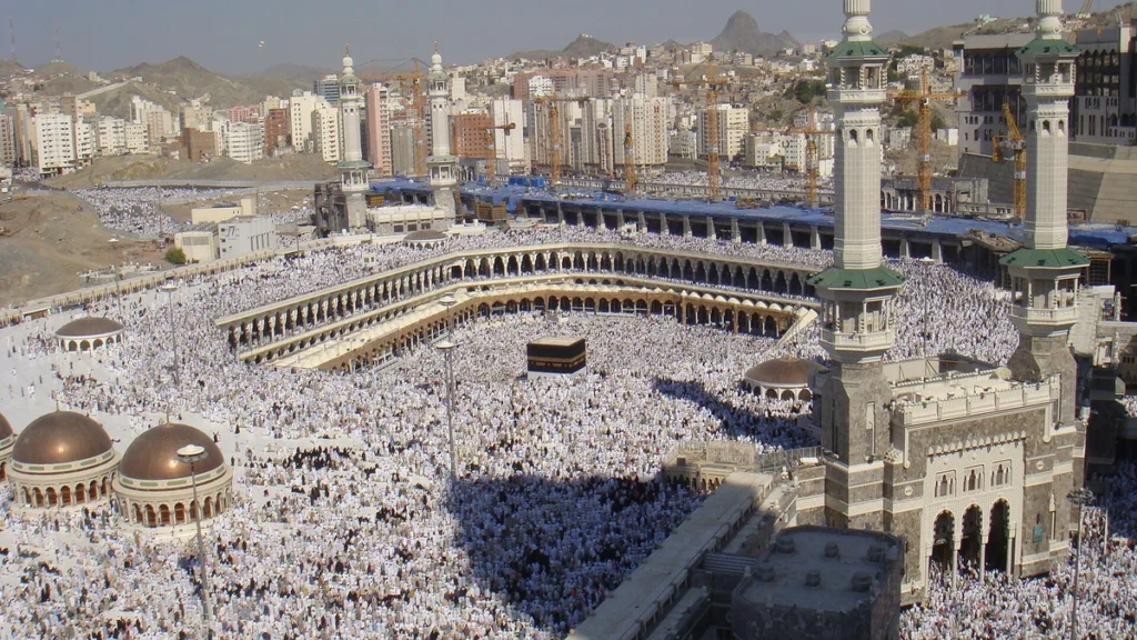 Pilgrims around the Kaaba and the Grand Mosque in Makkah