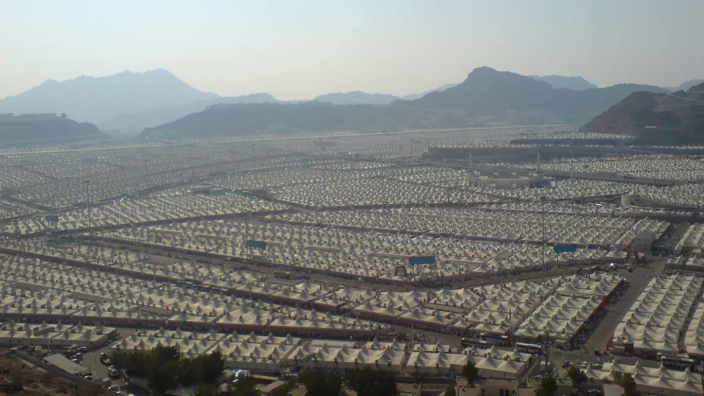 The tent city of Mina near Makkah, seen from a hillside with mountains behind